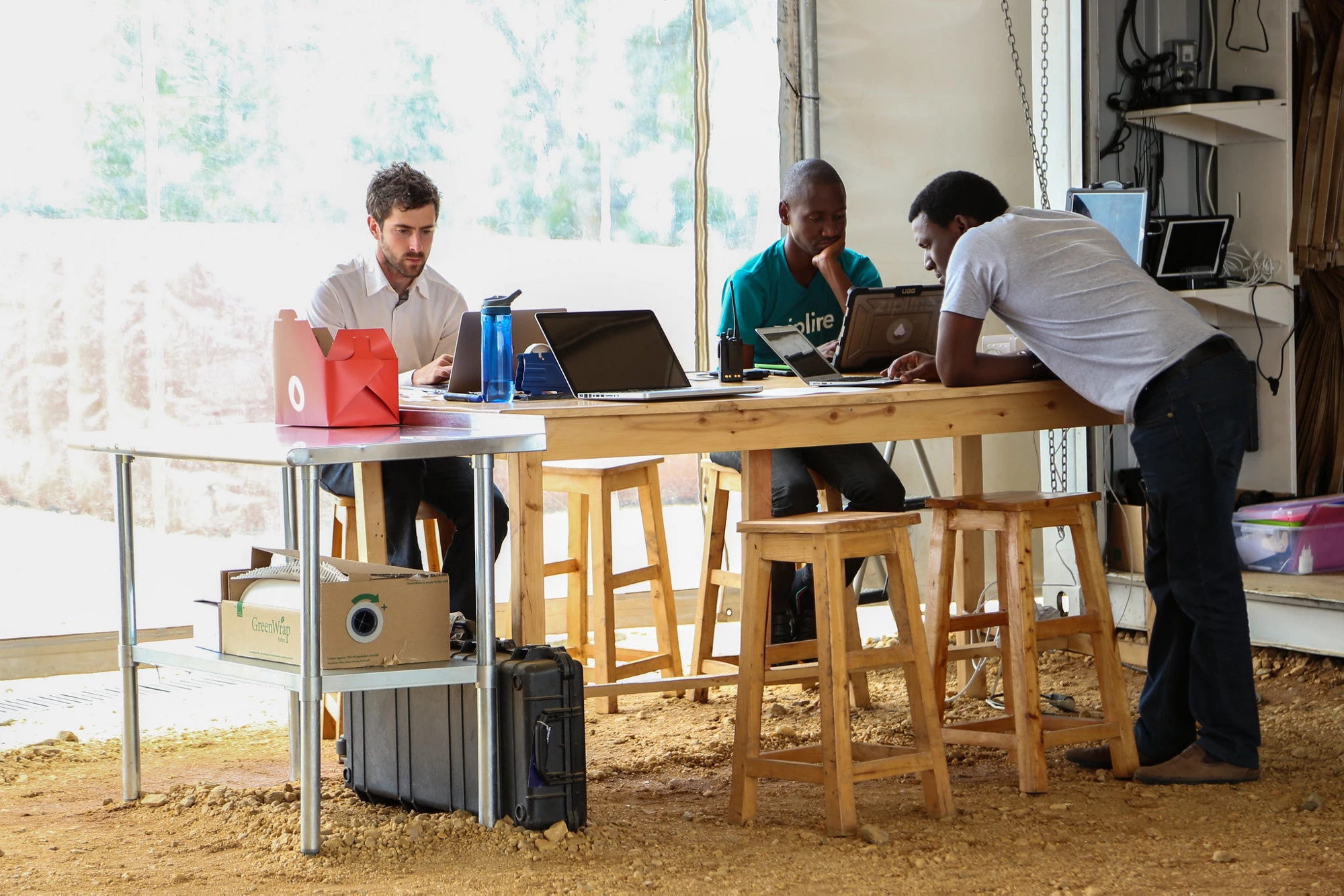 Technicians working in the programming of supply drones for hospitals in Rwanda.