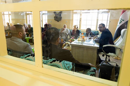 Teachers speak with the principal of the newly opened school.