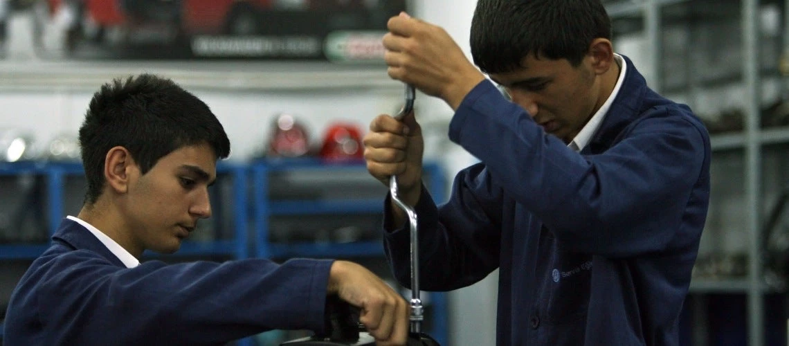 Students work on an engine at Sisli Vocational High School