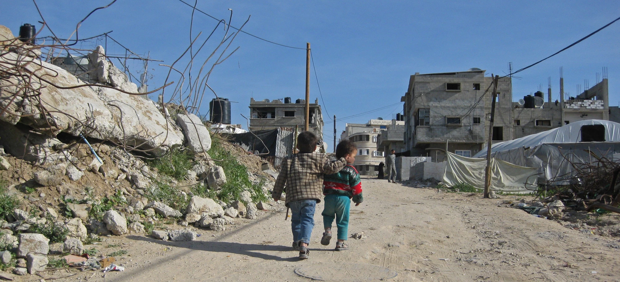 Children walking on a road in Gaza. A new project to improve solid waste management for nearly 1 million people living in Gaza is expected to begin soon.