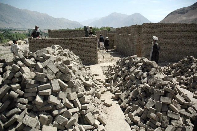 Workers build the Shash Pul school project in Afghanistan