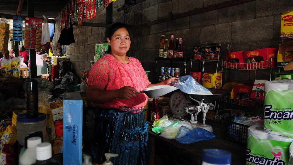 A woman attends her market, Guatemala City. Guatemala.