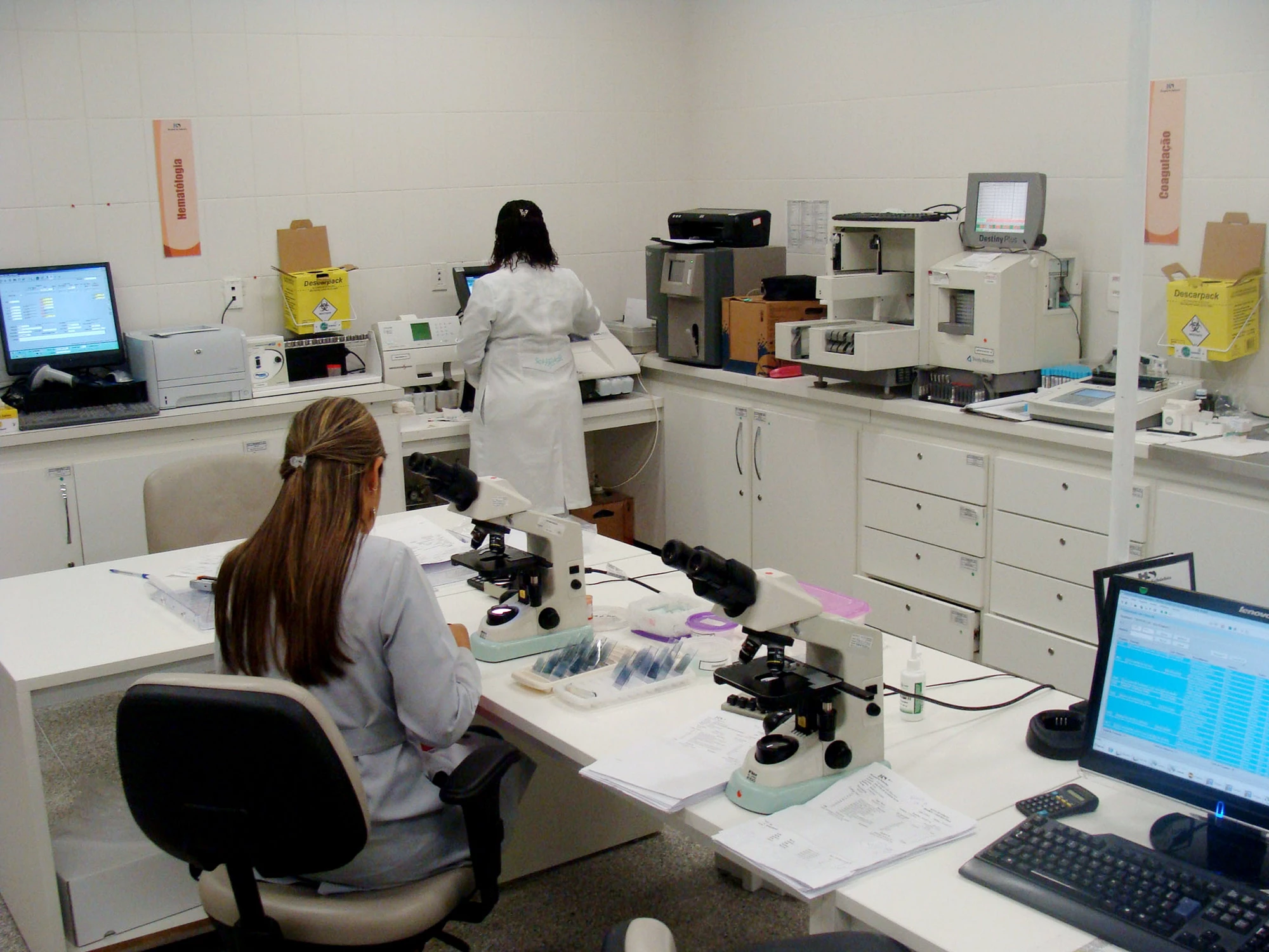 Lab technicians analyze blood samples at Hospital do Subúrbio (Suburban Hospital), Brazil's first hospital under a public-private partnership model, in a low-income area of Salvador, Bahia.