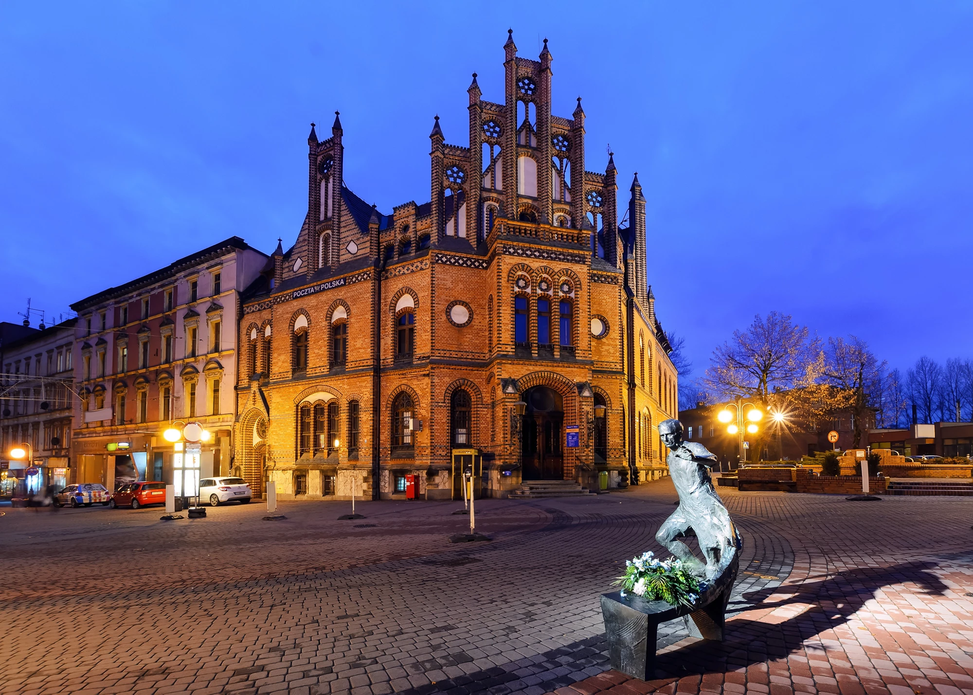 Chorzow near Katowice in Poland. Historic post office edifice built in XIX century in neo-Gothic style in the evening.
