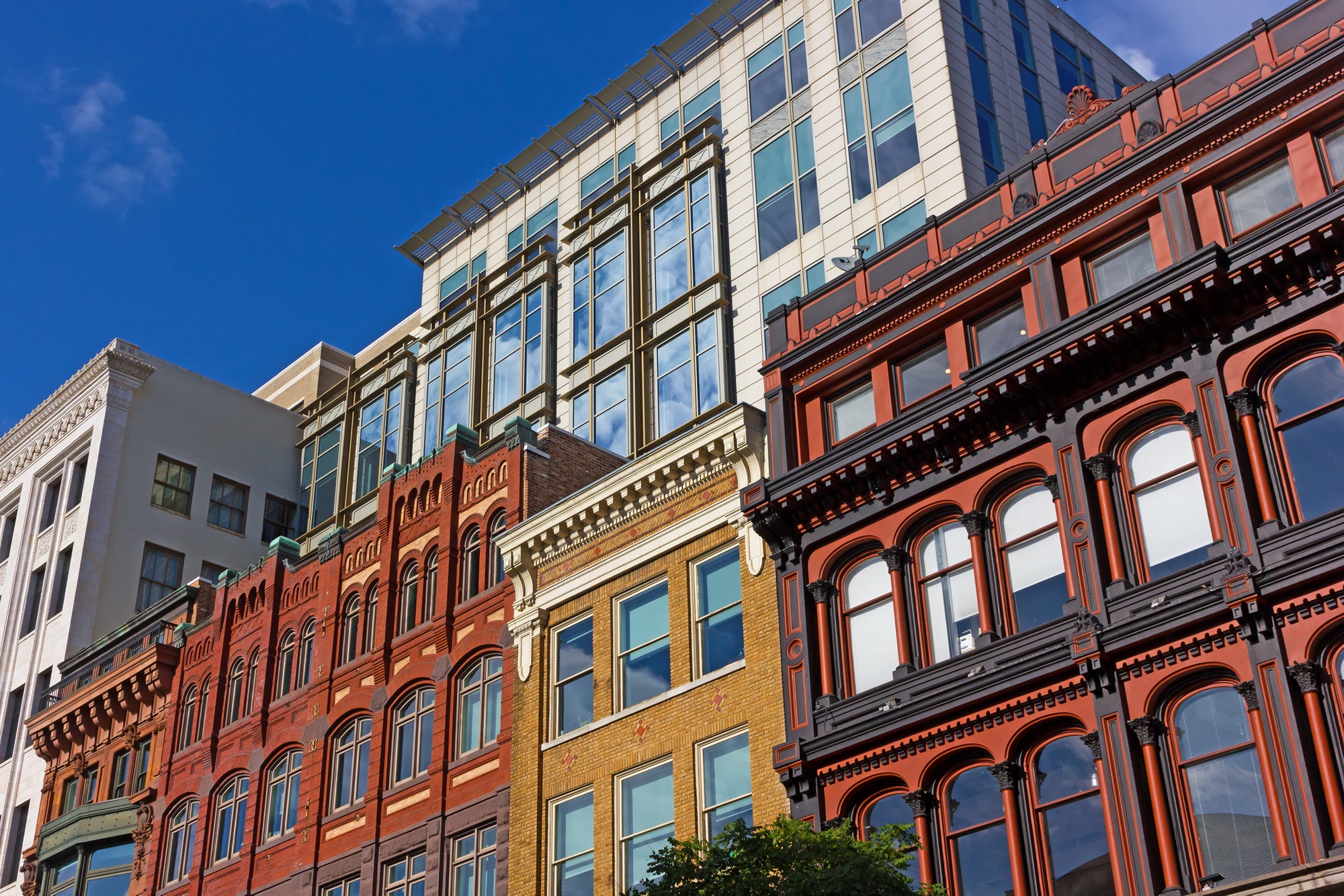 Urban architecture of Washington Dc downtown before sunset. Historical building in front of modern development.