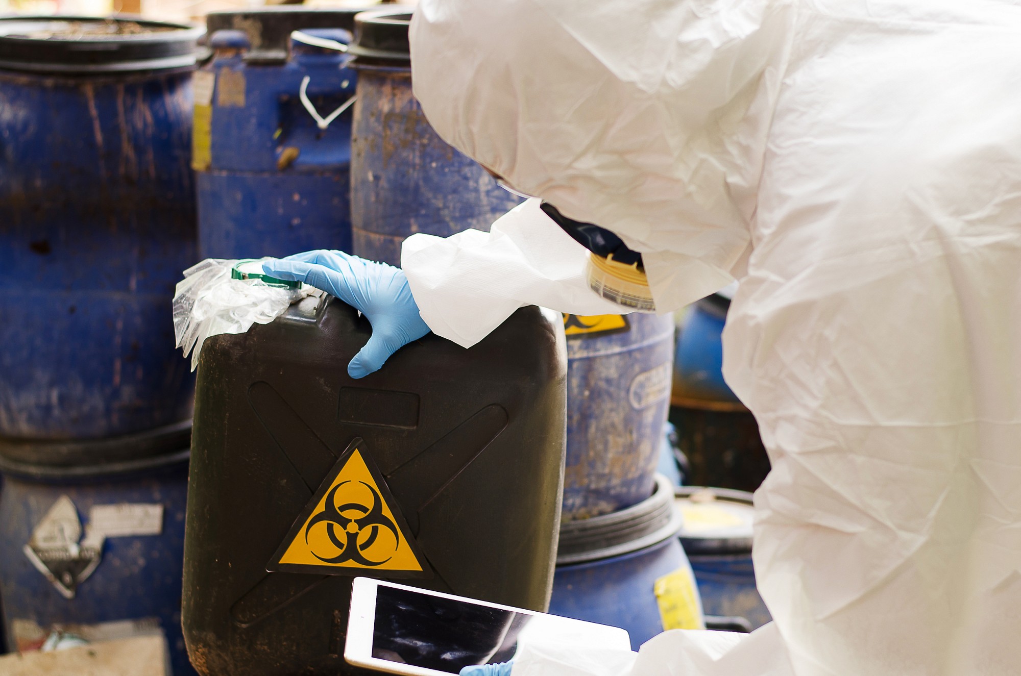 Asian scientist wear Chemical protection suit check danger chemical,working at dangerous zone