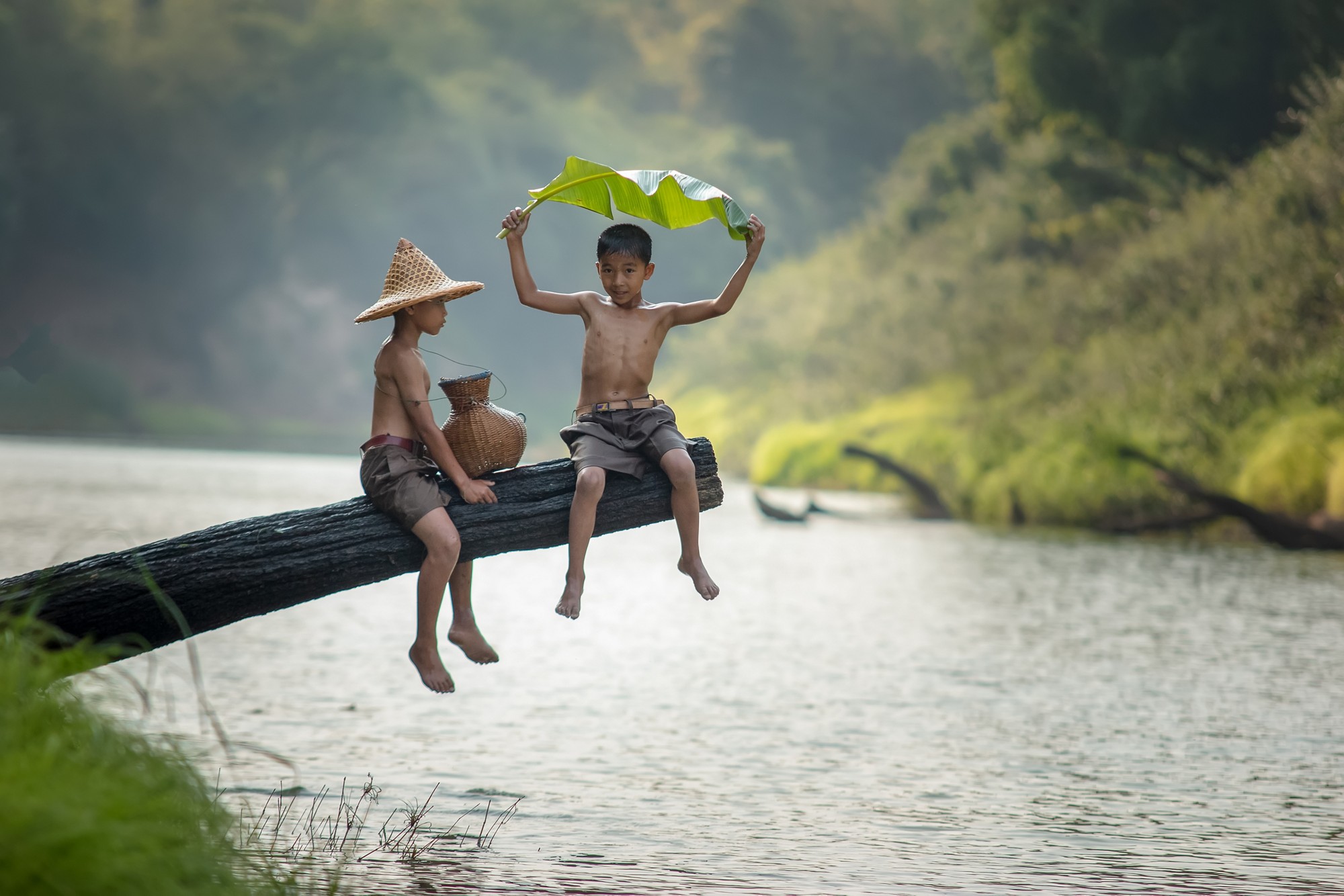 Children poverty living in countryside Vietnam are fishing at the river,Rural concept of Asia