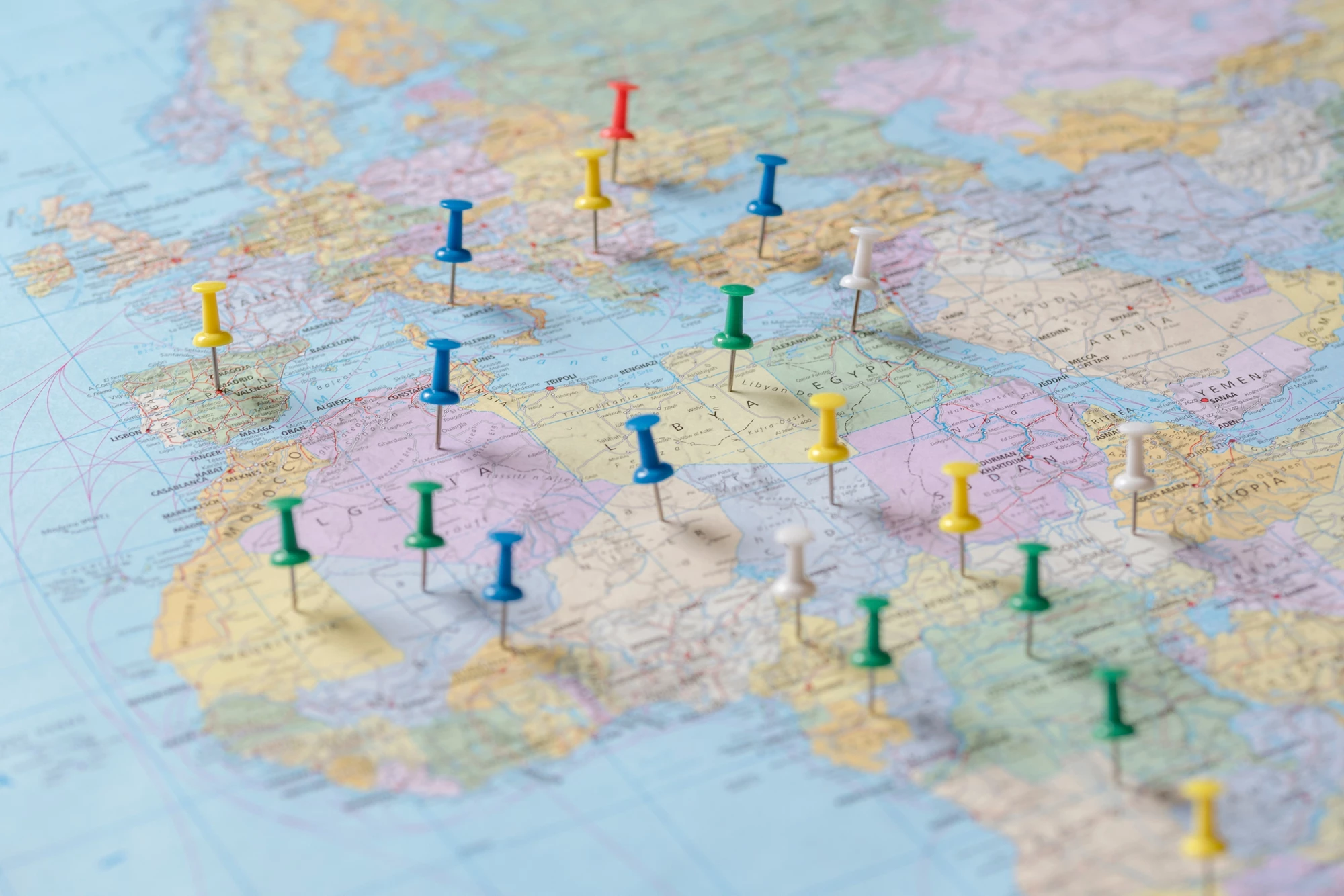 Push pins on the world map