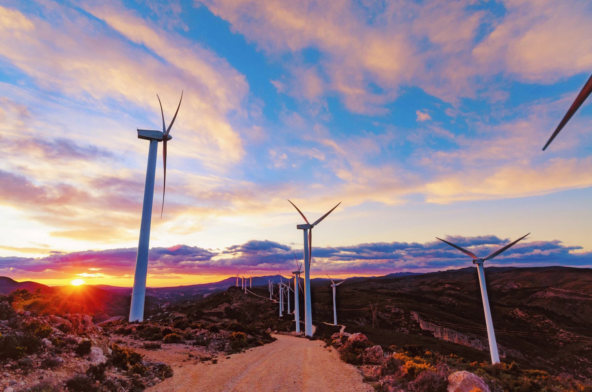 Wind turbines producing electricity on a mountain in the Valencian Community