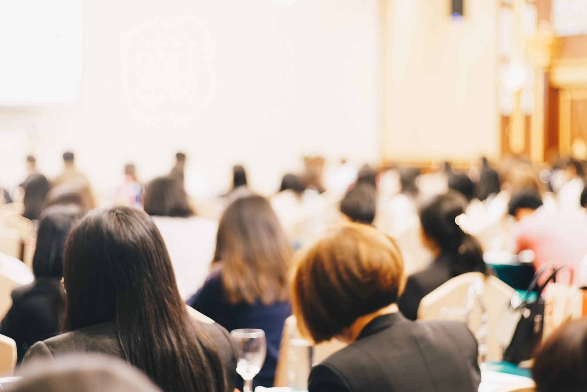 Abstract blurred people sitting seminar in hotel room business education background