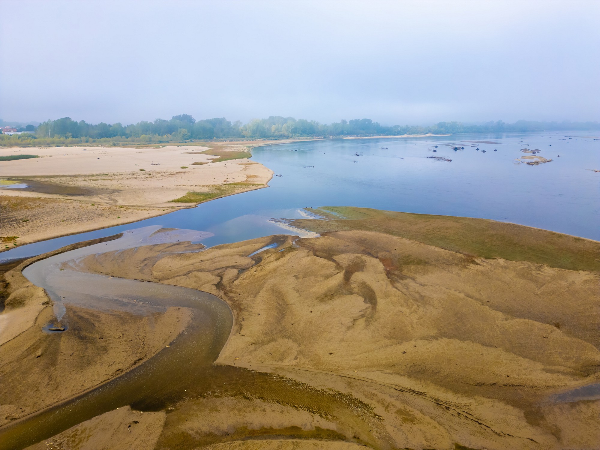 Drying out of the river bed during the summer drought, climate changes causing depletion of surface and groundwater, and climatic and weather anomalies.