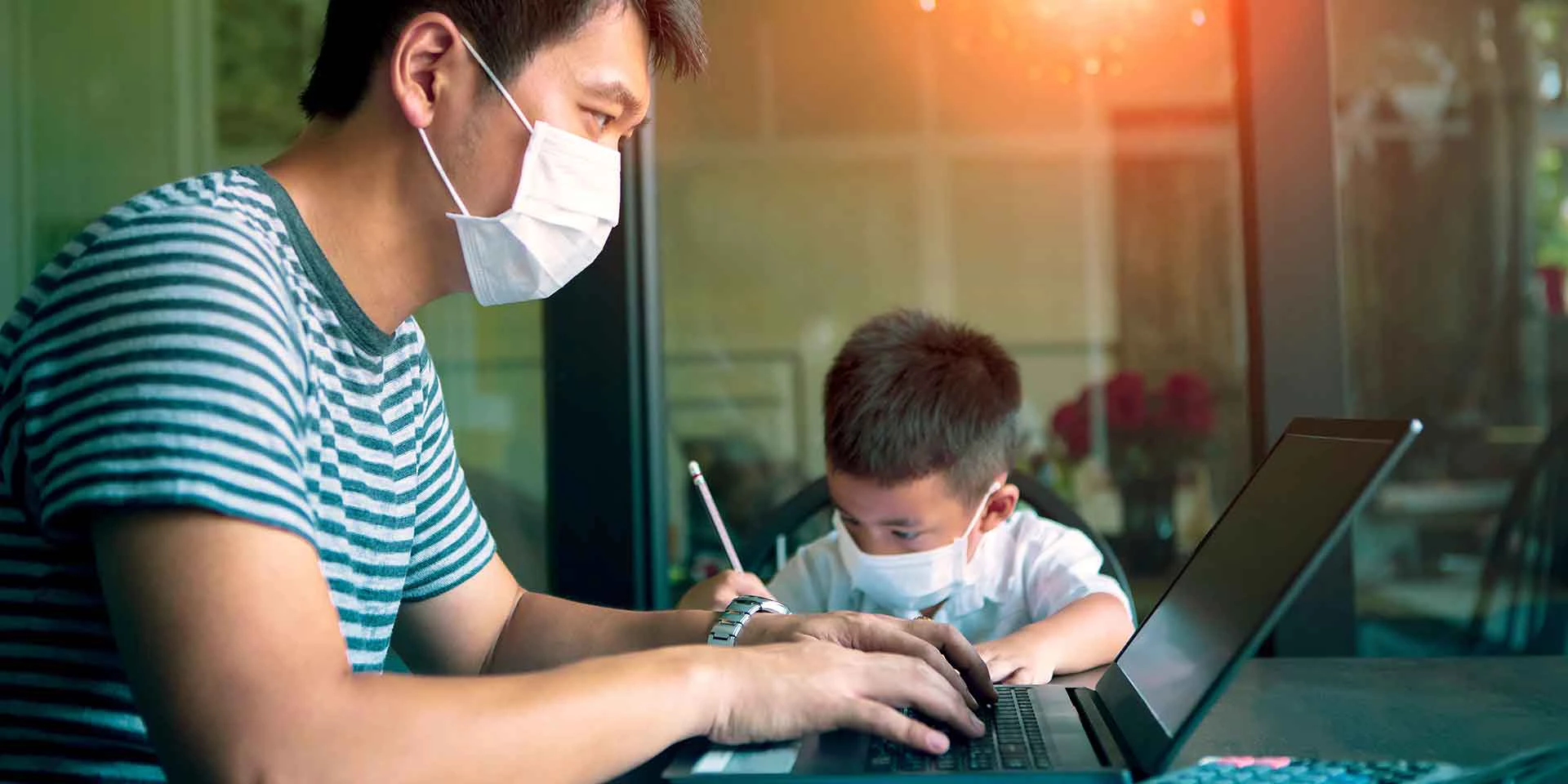 quarantine asian man and children wearing protection mask working on computer at home while covid-19 virus inflected global