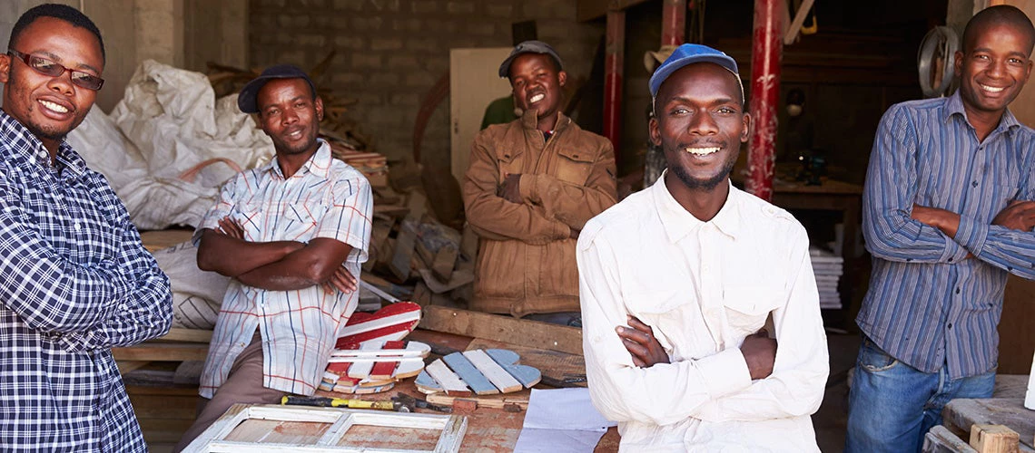 Five workers in a carpentry workshop, South Africa. | © shutterstock.com
