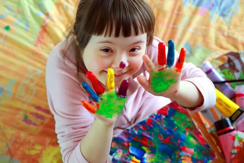 Cute little girl with painted hands - Denis Kuvaev shutterstock