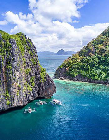 Aerial Drone Picture of limestone islands and crystal clear water in El Nido, Palawan in the Philippines