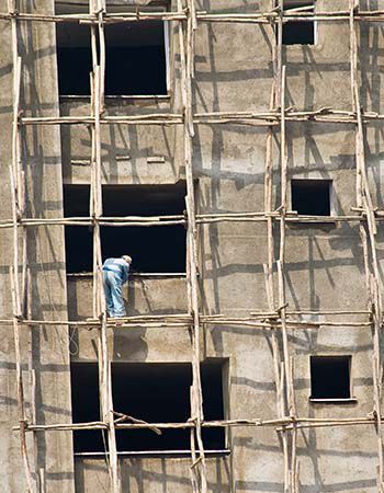 ADDIS ABABA, ETHIOPIA - MARCH 05, 2010: Unidentified men on a construction site work on a building in the center of Addis Ababa. 