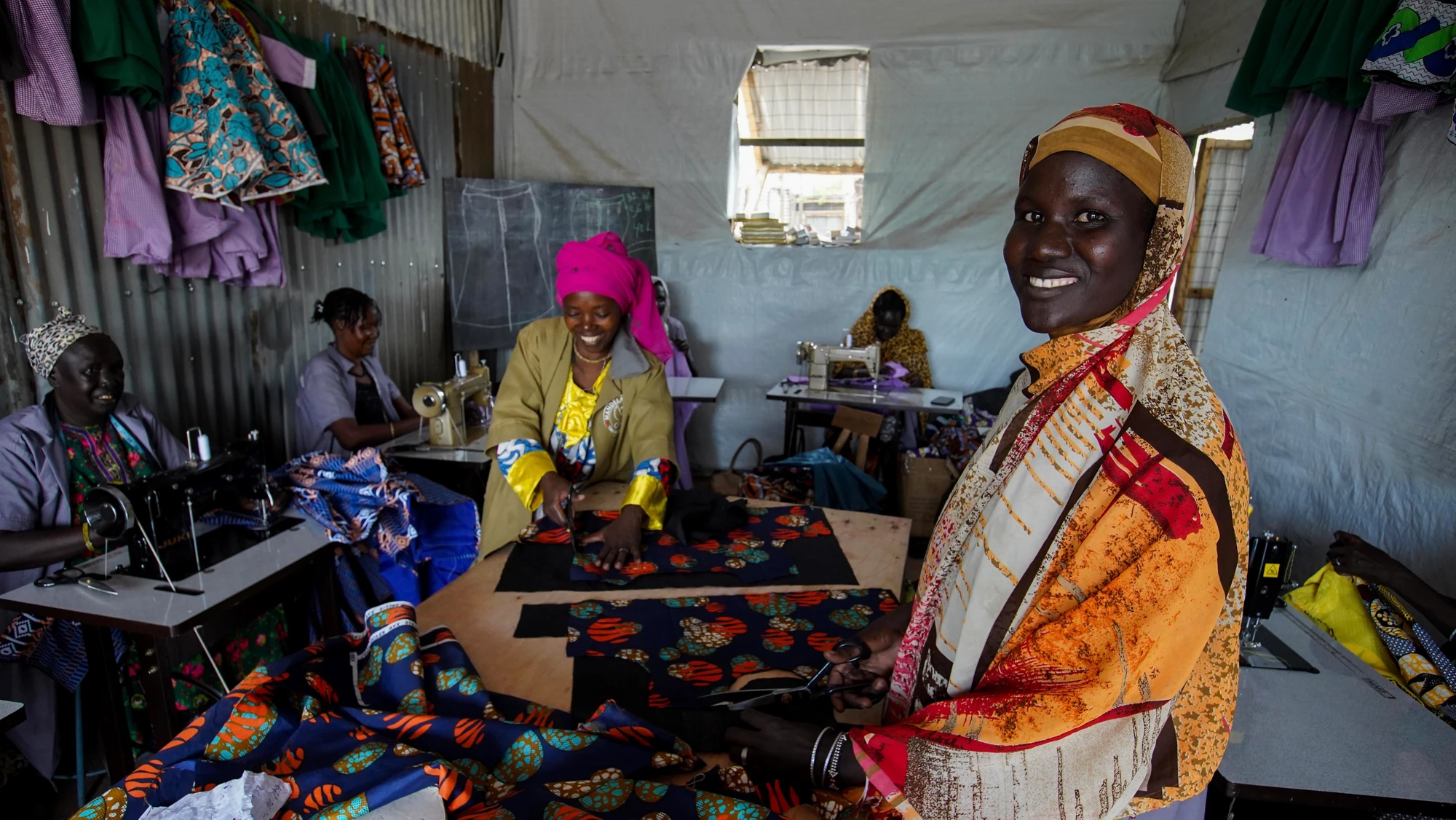 South Sudanese refugee women attend a tailoring class with Mandela ‘Vision’ Tailoring Shop in Kenya’s Kakuma Refugee Camp. The shop is a beneficiary of the Kakuma Kalobeyei Challenge Fund (KKCF), IFC’s first refugee and host community focused program in sub-Saharan Africa.