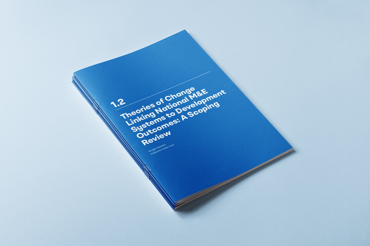 1-2: Blue booklet cover titled "1.2 Theories of Change Linking National M&E Systems to Development Outcomes: A Scoping Review."