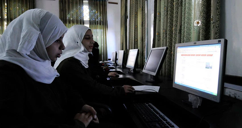 Girls use computers at the Shaheed Mohamed Motaher Zaid school