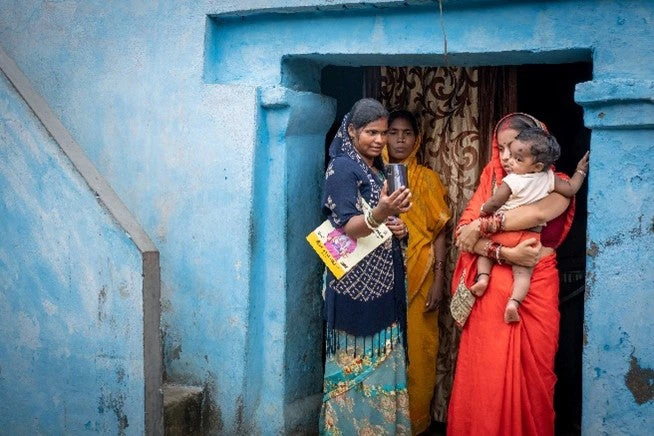 Poshan Sakhi with women benefeciaries from Bihar, India