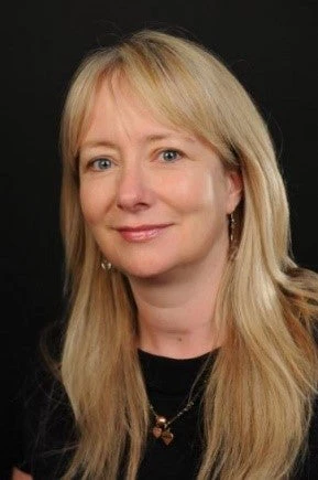 A photo of Jo Bourne looking at the camera