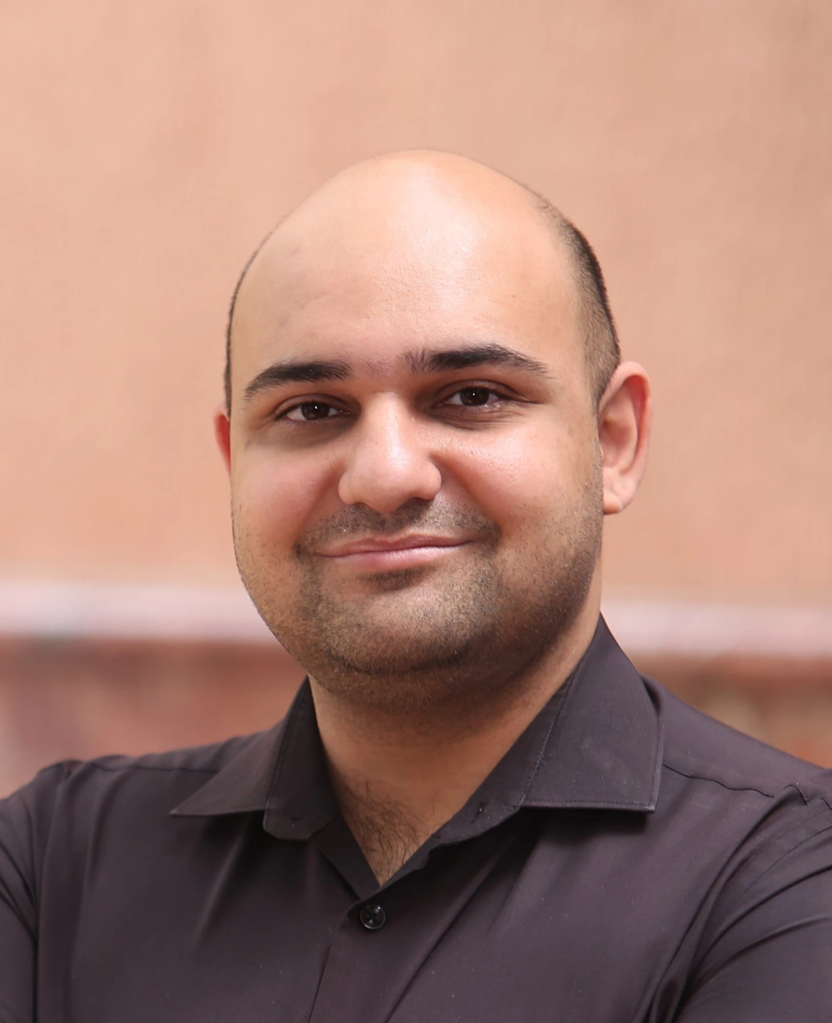 South Asian man in black shirt