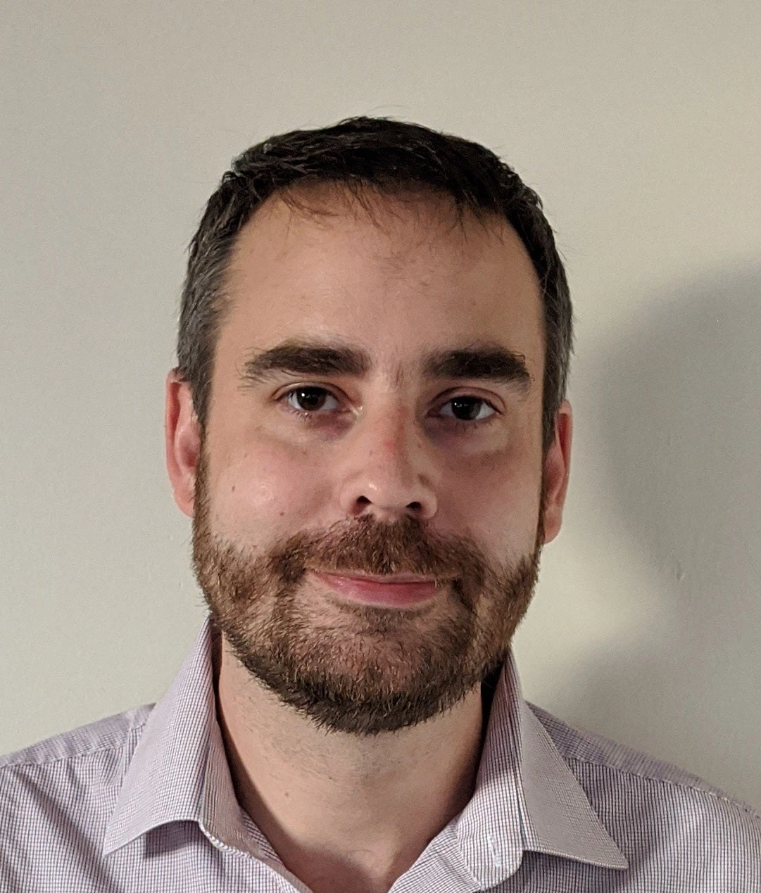 Caucasian man with light brown short hair and beard