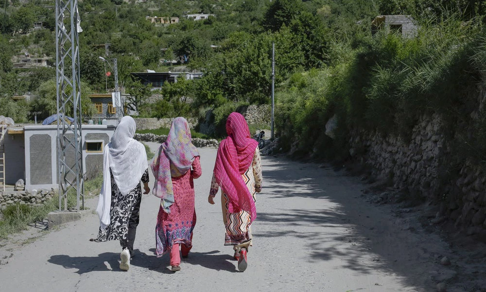 Women walking on the road