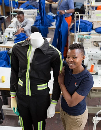 Thabi Mkhwanazi show the various style workers clothes that they produce at the Khanyile Solutions factory in Johannesburg, South Africa, Friday, 05, Oct 2018.Photo/Karel Prinsloo/IFC