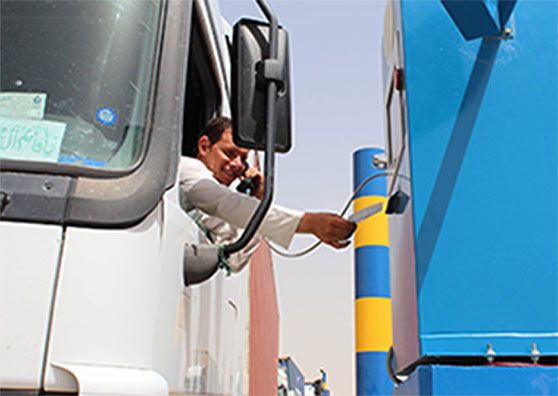 A truck driver accessing an electronic entry point.