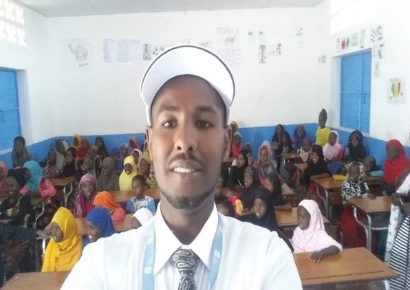 Ragueh with his students in class in Djibouti.