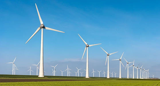 Beautiful green aerial view of windmill farm.