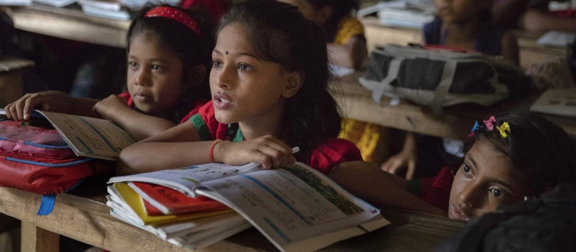 Students participate in class while listing to class teacher at the Sujat Nagar urban slum school in Dhaka, Bangladesh