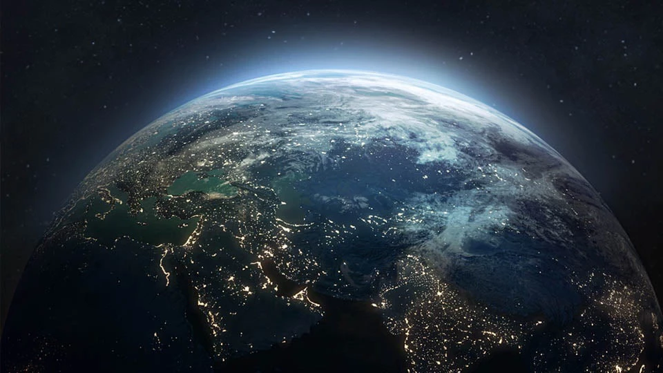 Nighttime image of the Earth, with lights illuminating the countries