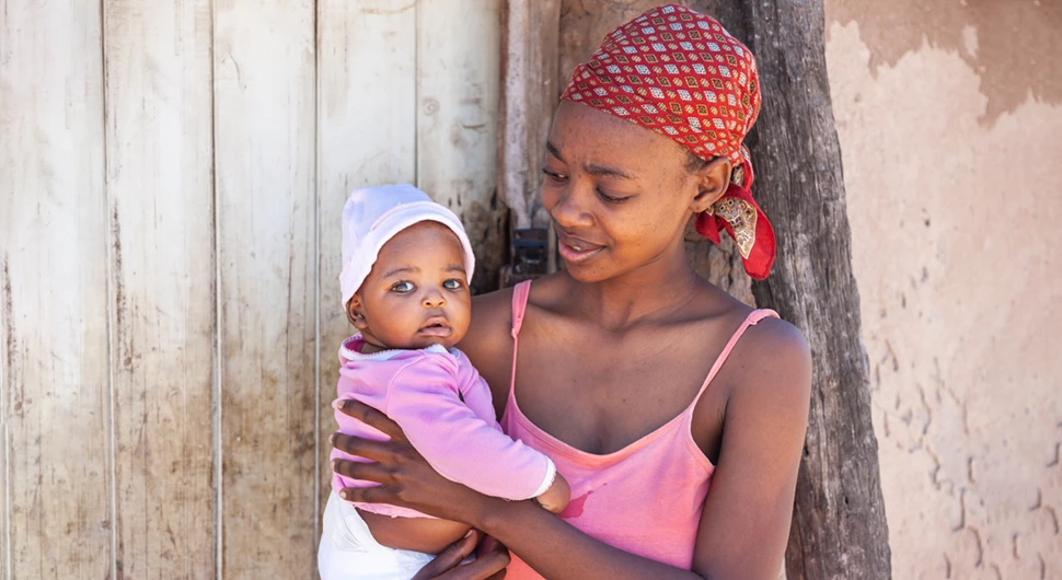 Single young African mother in a village in Botswana