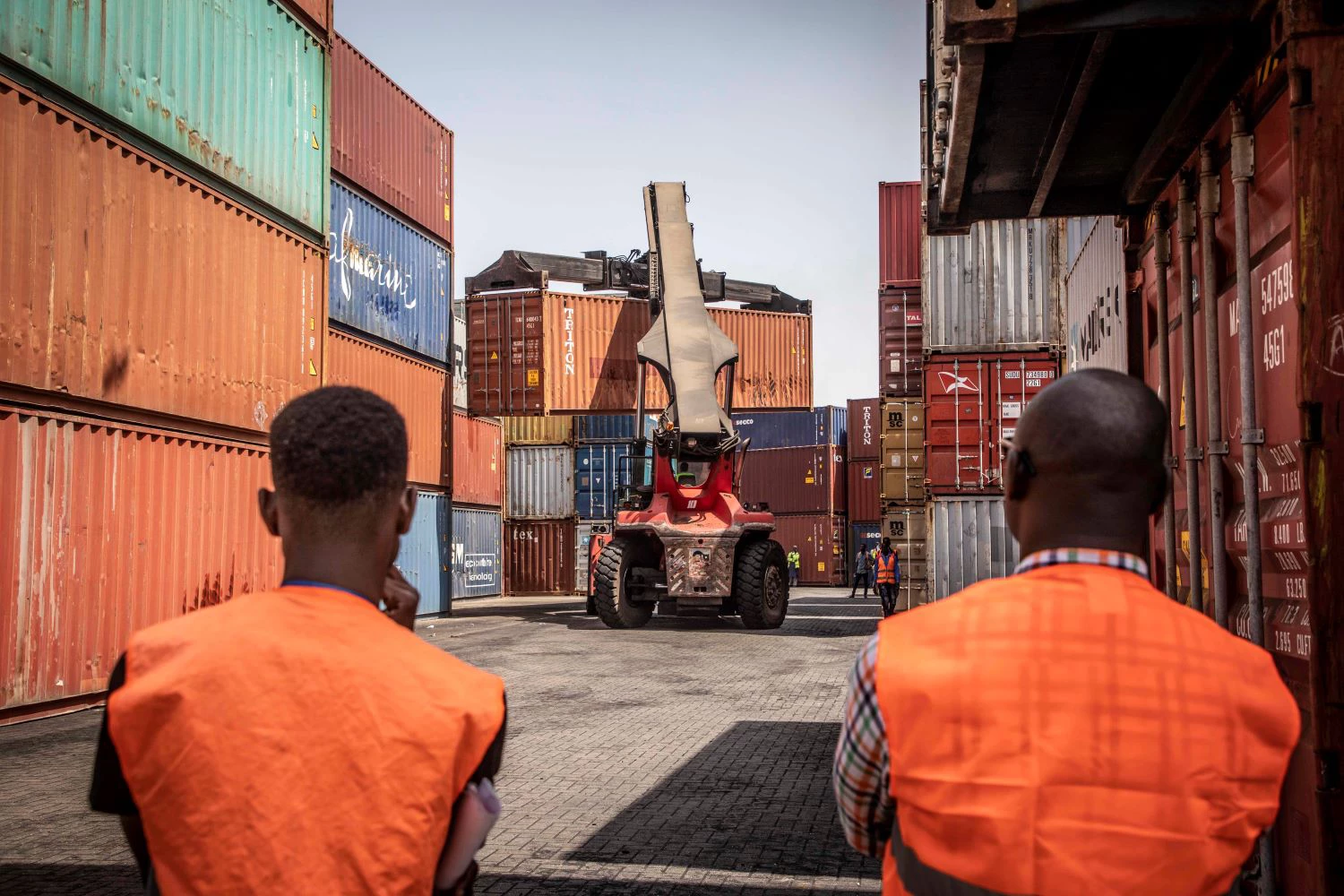 A photo of two port workers in The Gambia.