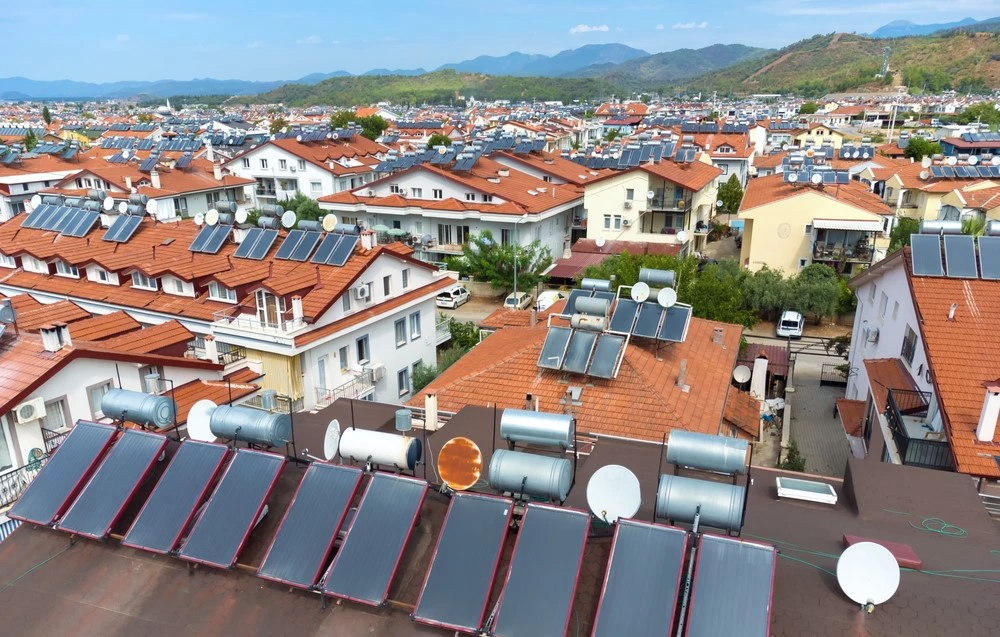 A photo of photovoltaic solar panels from a drone on the roof of a country house in Tukiye.