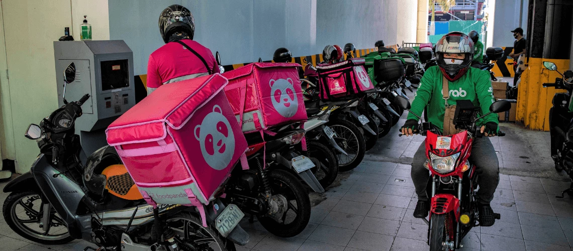 motorcycle delivery drivers pack their motorcycles