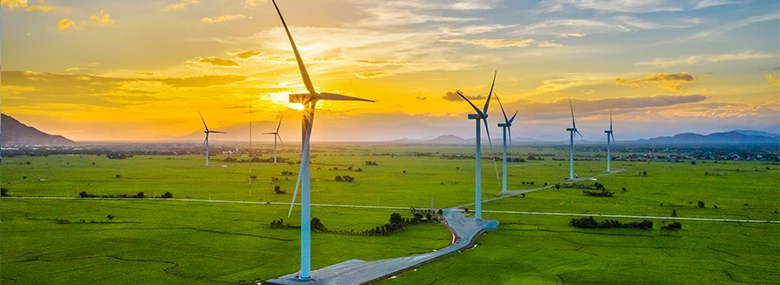 Wind turbines generating electricity on rice field at Phan Rang, Ninh Thuan, Vietnam. | © Adobe Stock