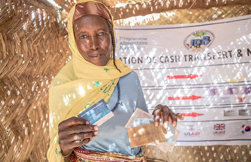 Photo of a woman holding a card