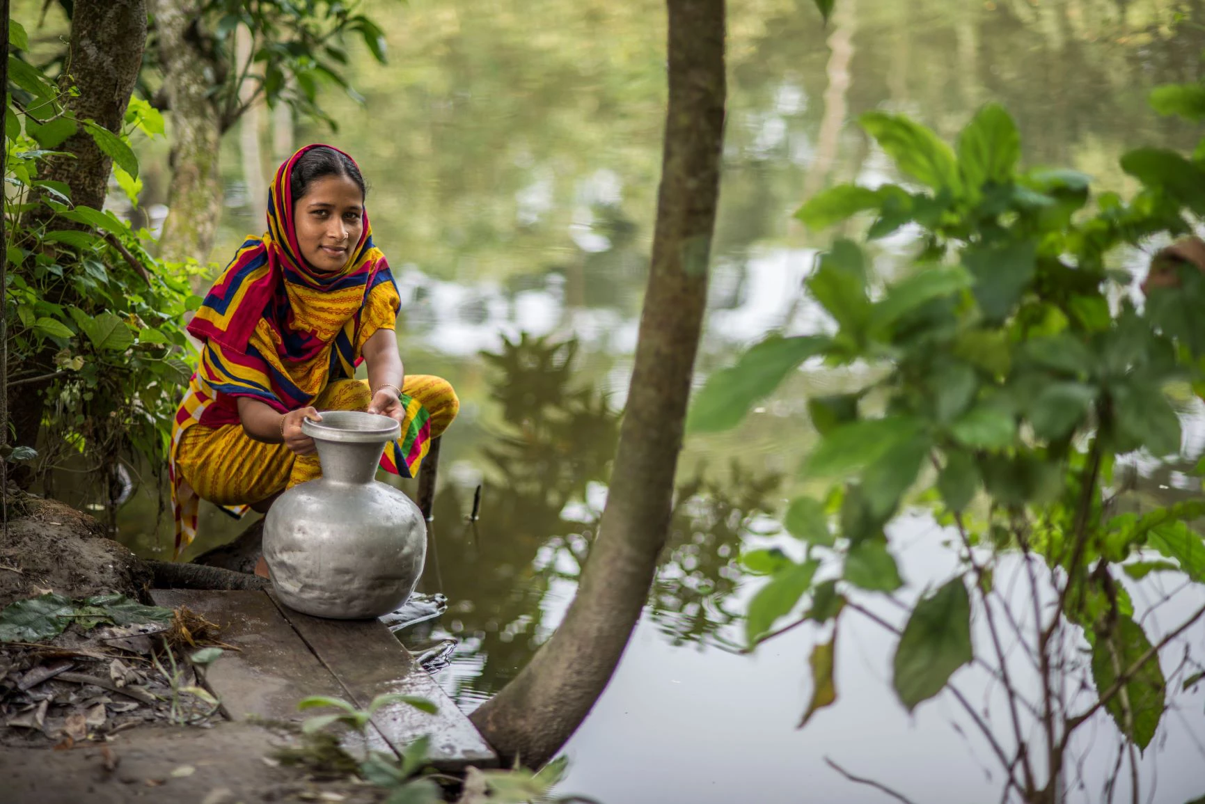 rural Bangladesh woman near a pond