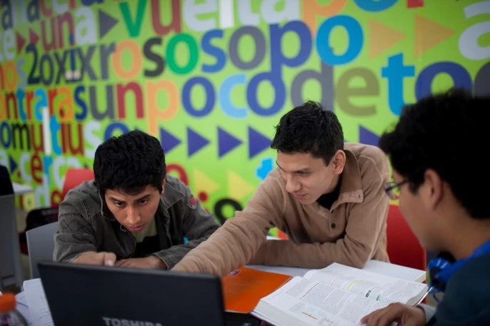 Students at Catholic University of Peru use their laptops to do their homework
