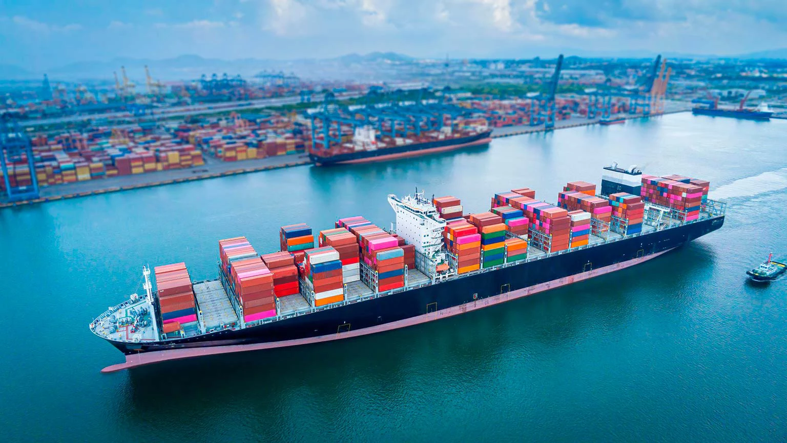Aerial view of a container ship at an open seaport. Photo © AdobeStock