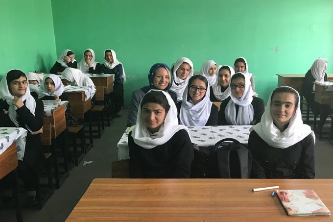 Nathalie Lahire attends a class along with students in Abul-Qasim Ferdowsi Girls High School in Kabul