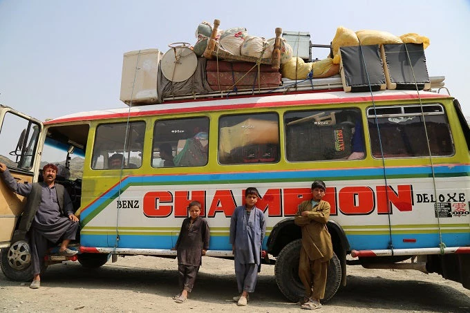 A bus with returnees from Pakistan at the IOM Screening center on Turkham border in Nangarhar province 