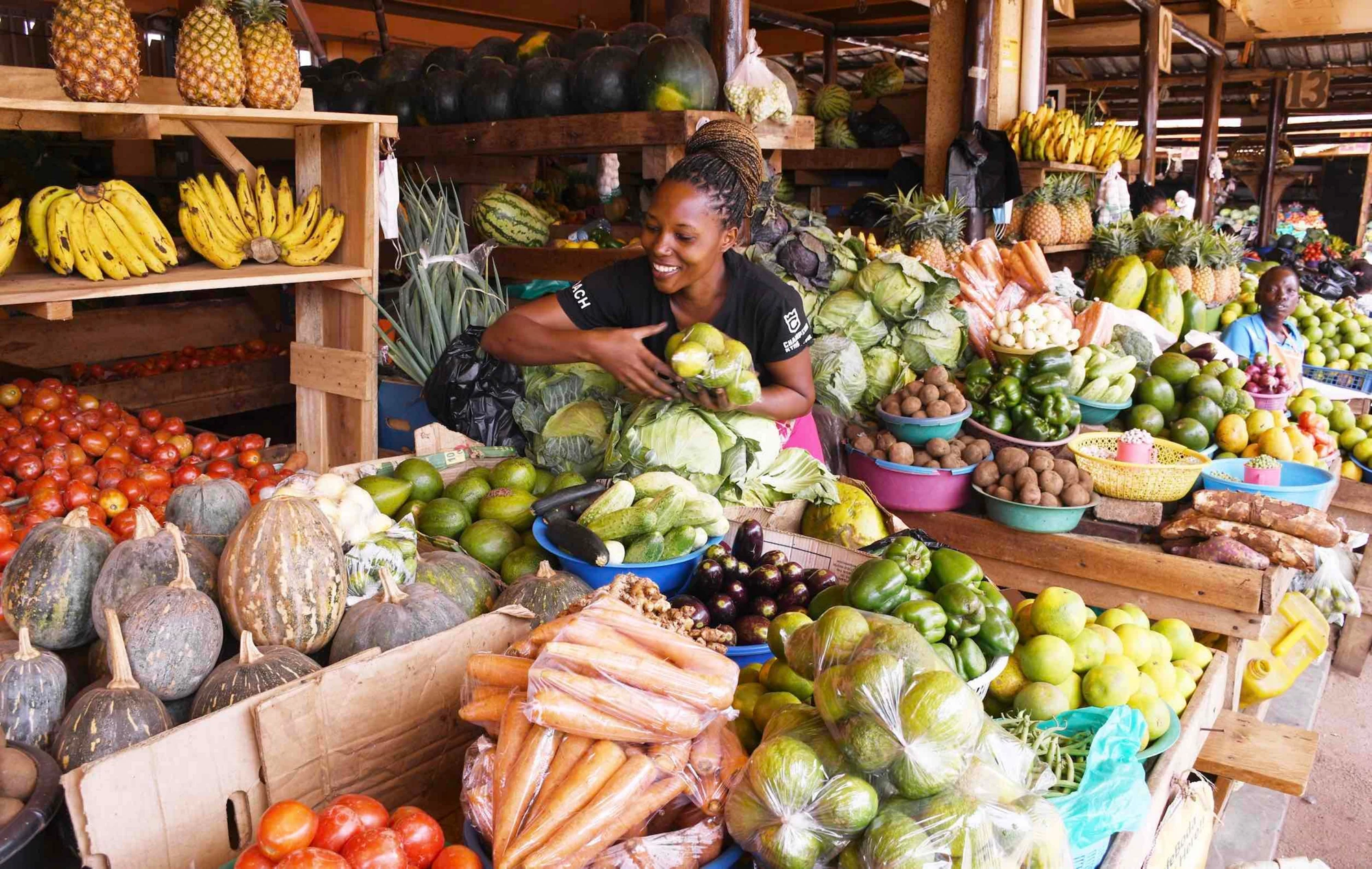 Woman selling vegetables in Naalya market.