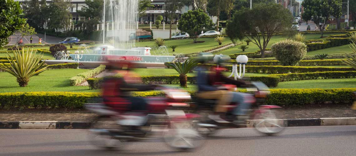 Traffic on a roundabout near Kigali's central business district. Kigali, Rwanda. Photo: Kelley Lynch / World Bank