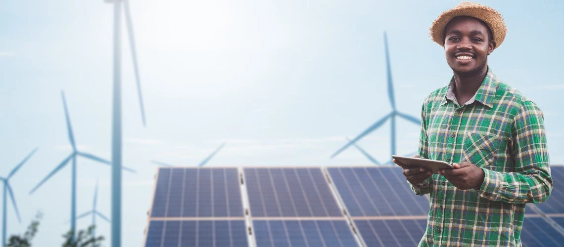 Worker in front of photovoltaic panels