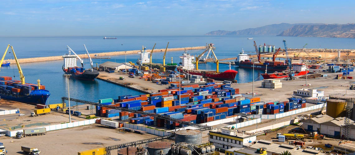 Shipping crates are loaded onto boats at the Port of Oran, a coastal city of Algeria.