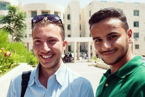 Students on university campus - Shutterstock l Zurijeta